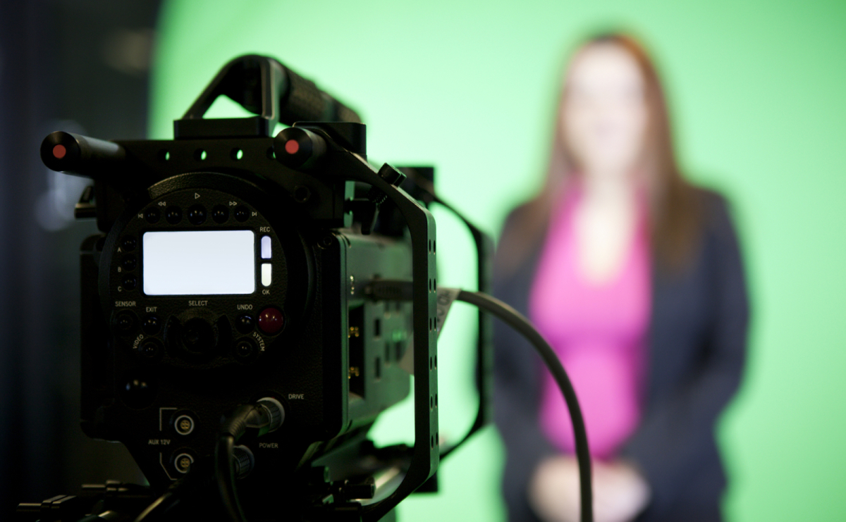Camera filming woman making a presentation